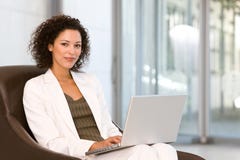 Attractive Business Woman Working On Laptop Stock Photo