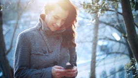Attractive Businesswoman outdoor with mobile phone stock video Attractive Businesswoman outdoor with mobile phone stock video