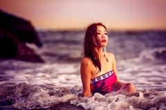 Attractive Chinese girl on the beach stock photo Attractive Chinese girl on the beach stock photo