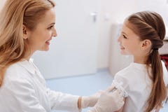 Attractive family doctor vaccinating her patient against diseases royalty free stock photo Attractive family doctor vaccinating her patient against diseases royalty free stock photo