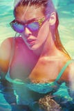 Attractive girl in bikini and sunglasses in pool royalty free stock images Attractive girl in bikini and sunglasses in pool royalty free stock images