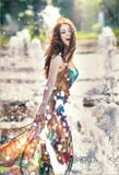 Attractive Girl In Multicolored Short Dress Playing With Water In A Summer Hottest Day. Girl With Wet Dress Enjoying Fountains Stock Photo Attractive Girl In Multicolored Short Dress Playing With Water In A Summer Hottest Day. Girl With Wet Dress Enjoying Fountains Stock Photo
