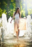 Attractive Girl In Playing In Water Fountain Stock Image