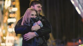 Attractive pretty couple spends date night at amusement park at night stock video Attractive pretty couple spends date night at amusement park at night stock video