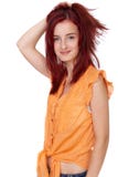 Attractive redhead girl in orange shirt, isolated Stock Image Attractive redhead girl in orange shirt, isolated Stock Image