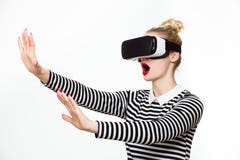 Attractive woman wearing virtual reality goggles. VR headset.