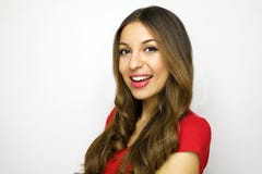 Attractive young businesswoman looking to the camera on white background. Portrait of cheerful beautiful girl with red t-shirt Royalty Free Stock Photography Attractive young businesswoman looking to the camera on white background. Portrait of cheerful beautiful girl with red t-shirt Royalty Free Stock Photography