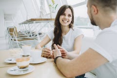 Attractive young couple on a date in a cafe stock images Attractive young couple on a date in a cafe stock images