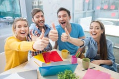 Attractive young designers are expressing positive royalty free stock image Attractive young designers are expressing positive royalty free stock image
