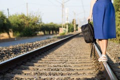 An attractive young woman with long brown hair walking near the railway royalty free stock image An attractive young woman with long brown hair walking near the railway royalty free stock image