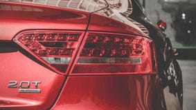 Audi front-view lights , Closeup headlights of car back bumper royalty free stock image Audi front-view lights , Closeup headlights of car back bumper royalty free stock image