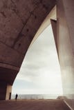 Auditorio de Tenerife, Santa Cruz de Tenerife, Espania - October 26, 2018: One man admire the view through a side panel of the royalty free stock images Auditorio de Tenerife, Santa Cruz de Tenerife, Espania - October 26, 2018: One man admire the view through a side panel of the royalty free stock images