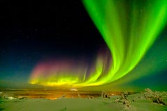 Aurora borealis also known like northern or polar lights beyond the Arctic Circle in winter Lapland