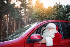 Authentic Santa Claus Driving Car With Christmas Tree Royalty Free Stock Photos