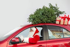 Authentic Santa Claus Driving Red Car With Gift Boxes Royalty Free Stock Photography