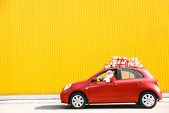 Authentic Santa Claus Driving Red Car With Gift Boxes Stock Photography Authentic Santa Claus Driving Red Car With Gift Boxes Stock Photography