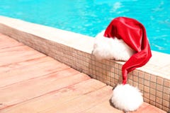 Authentic Santa Claus Hat Near Pool Royalty Free Stock Images