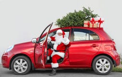 Authentic Santa Claus In Car With Gift Boxes Stock Images