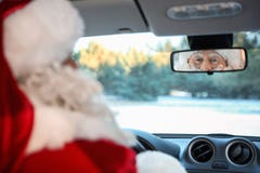 Authentic Santa Claus Looking Into Rear View Mirror Inside Royalty Free Stock Photos Authentic Santa Claus Looking Into Rear View Mirror Inside Royalty Free Stock Photos