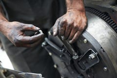 Auto mechanic hands at car repair work