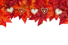 Autumn background with wood hearts and red and orange fall leave stock photo Autumn background with wood hearts and red and orange fall leave stock photo