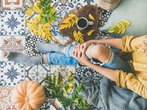 Female sitting on balcony with Autumn leaves, food, herbal tea royalty free stock photos Female sitting on balcony with Autumn leaves, food, herbal tea royalty free stock photos