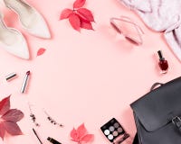 Autumn female clothes collection. Women fall fashion concept. Black backpack, shoes, scarf and cosmetics overhead stock photos Autumn female clothes collection. Women fall fashion concept. Black backpack, shoes, scarf and cosmetics overhead stock photos