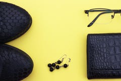 Autumn female outfit. Set of shoes and accessories on a yellow background royalty free stock photos Autumn female outfit. Set of shoes and accessories on a yellow background royalty free stock photos