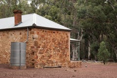 Homestead the original settler home with magpie on ground royalty free stock image Homestead the original settler home with magpie on ground royalty free stock image