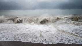 Autumn sea storm with splash from big waves at the beach Royalty Free Stock Photos Autumn sea storm with splash from big waves at the beach Royalty Free Stock Photos