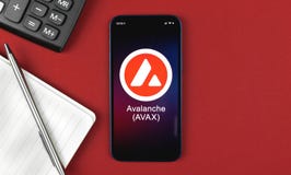 Avalanche AVAX symbol. Trade with cryptocurrency, digital and virtual money, banking with mobile phone concept. Business