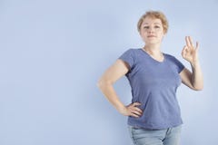 Average Age Woman Shows A Hand Gesture Ok Stock Photography Average Age Woman Shows A Hand Gesture Ok Stock Photography