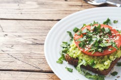 Avocado Toast. Healthy Toast With Avocado Mash And Tomatoes On A Plate Royalty Free Stock Photography