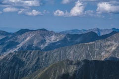 Rays of light on mountain ridges seen from Moldoveanu peak on a lovely summer day royalty free stock photo Rays of light on mountain ridges seen from Moldoveanu peak on a lovely summer day royalty free stock photo