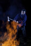 Axe Wielding Maniac By A Fire Royalty Free Stock Images