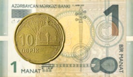 10 azerbaijani qepik coin against 1 azerbaijani manat bank note stock photo 10 azerbaijani qepik coin against 1 azerbaijani manat bank note stock photo