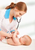 Baby And Doctor Pediatrician. Doctor Listens To The Heart With S Royalty Free Stock Image
