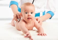 Baby And Doctor Pediatrician. Doctor Listens To The Heart With S Stock Photo