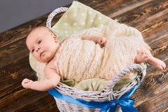 Baby in basket with bow. stock photos Baby in basket with bow. stock photos