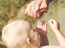 Baby blond beach water game mom royalty free stock photo Baby blond beach water game mom royalty free stock photo