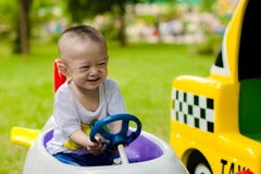 Baby boy driving toy car Baby boy driving toy car