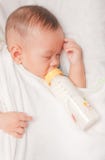 Baby Boy Holding Milk Bottle Stock Photography Baby Boy Holding Milk Bottle Stock Photography