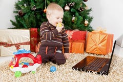 Baby Boy Playing With A Laptop And Toys At Christm Royalty Free Stock Images