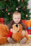 Baby Boy Playing With A Teddy Bear At Christmas Royalty Free Stock Photography