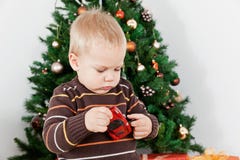 Baby Boy Playing With A Toy At Christmas Stock Image