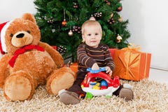 Baby Boy Playing With A Toy At Christmas Royalty Free Stock Image