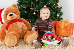 Baby Boy Playing With A Toy At Christmas Royalty Free Stock Photos