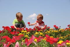 Baby and child in flowers
