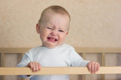 Baby Cry In Cot Stock Images