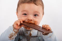 Image of cute babies eating chocolates